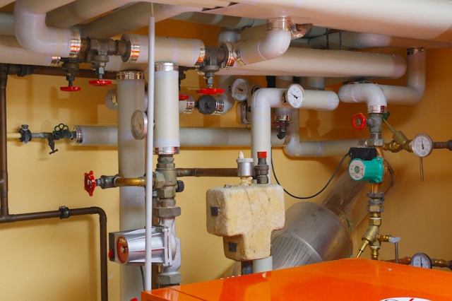 Technician inspecting a furnace during a heating tune-up